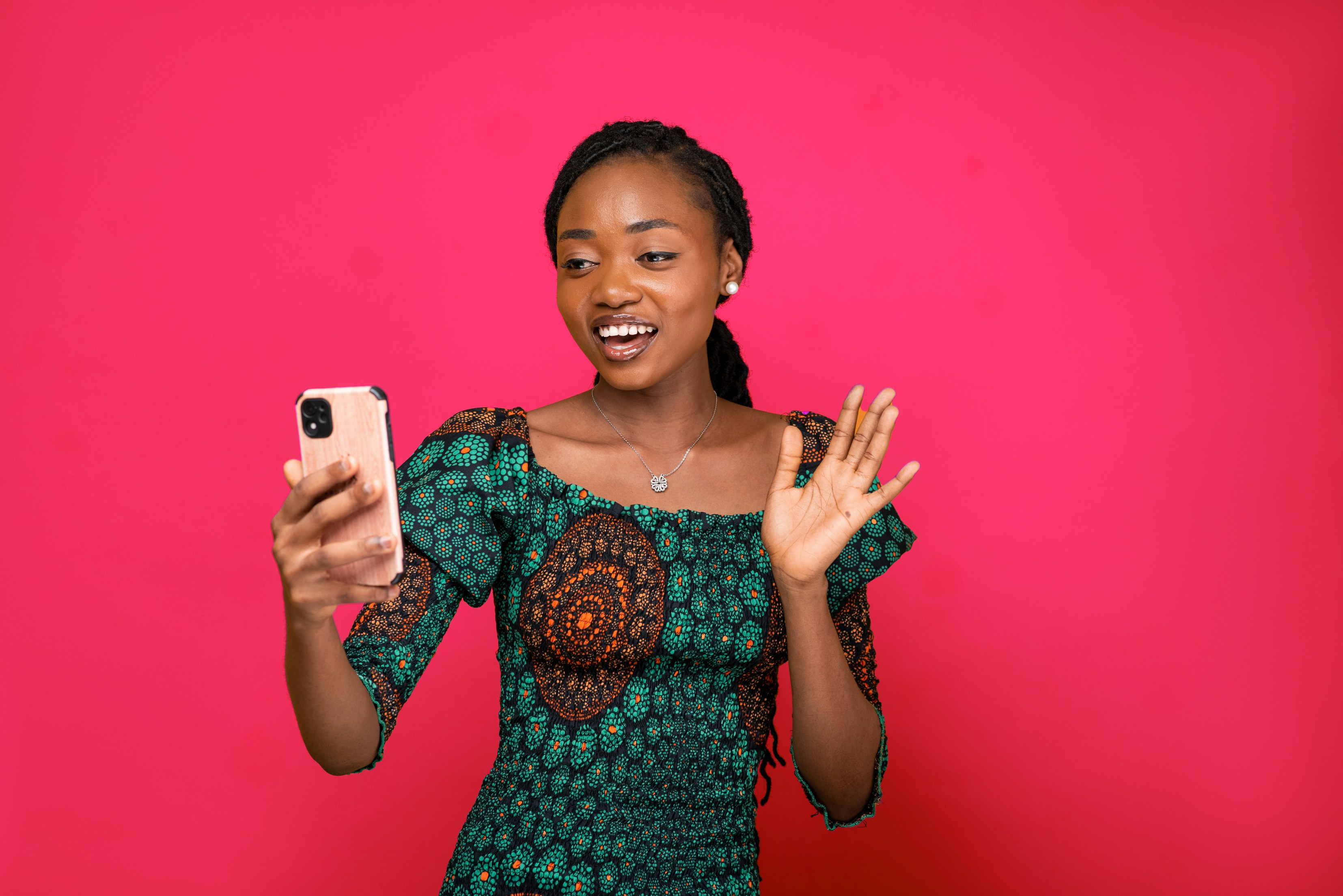 African business owners reviewing finances on a phone