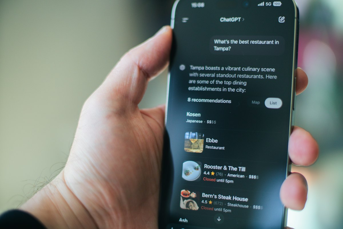 Close-up of a hand using ChatGPT on a phone screen