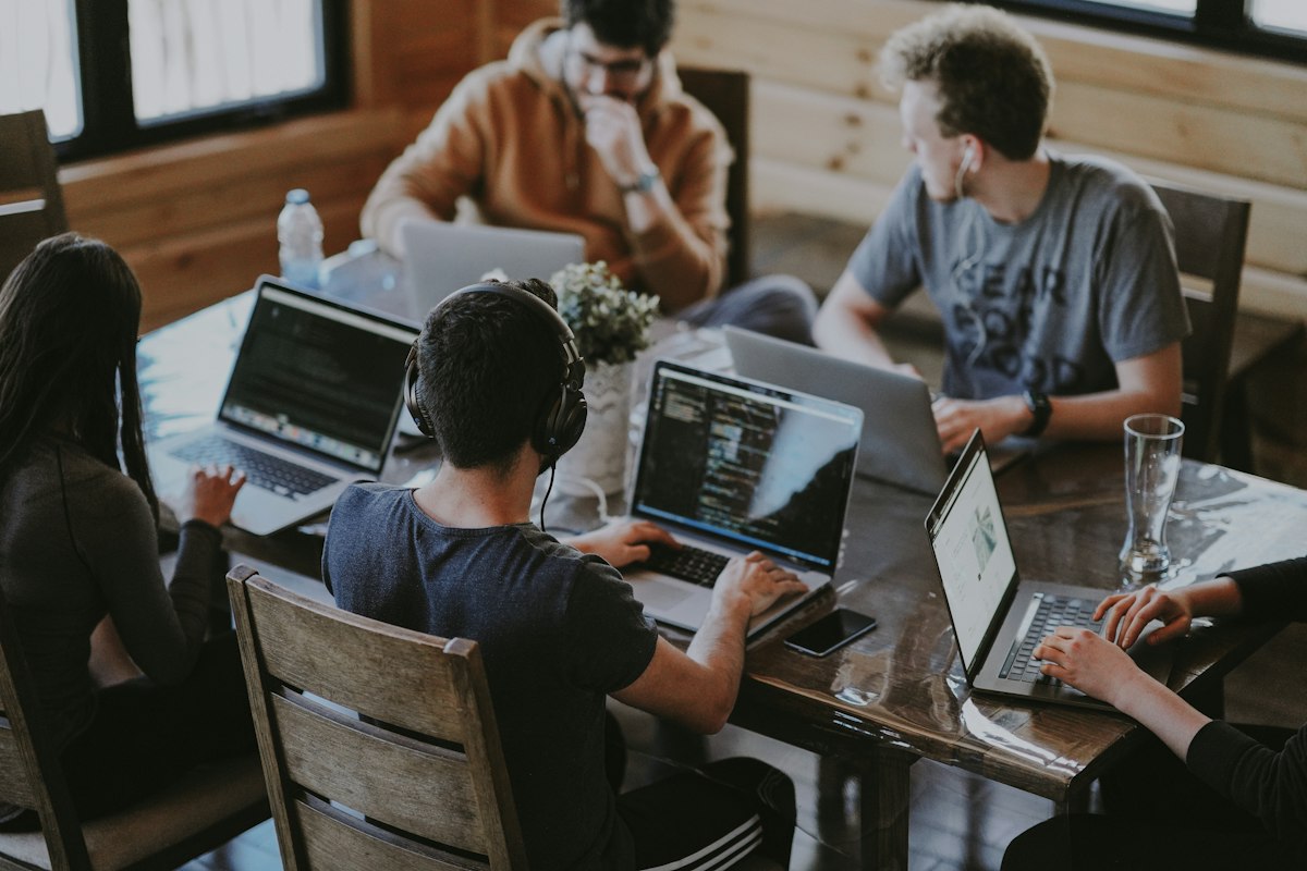 Developers collaborating on AI code