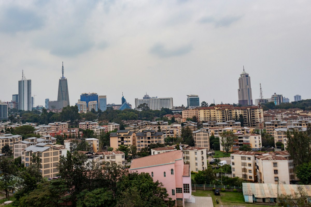 Nairobi city skyline with modern skyscrapers rising above residential buildings